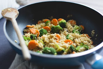 Cous cous with vegetables in a pan 