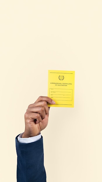 Covid-19 vaccine certificate held by a… | Free stock photo | High Resolution image