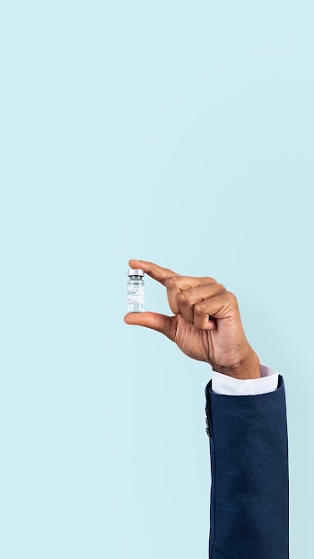 Covid-19 vaccine held by a… | Free stock photo | High Resolution image