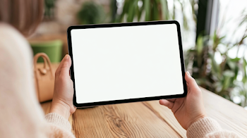 Cozy Cafe Moment: Woman Holding Blank Tablet