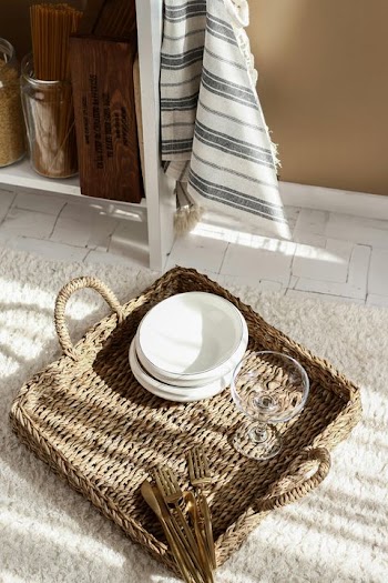 Cozy Kitchen Decor with Woven Tray and Tableware