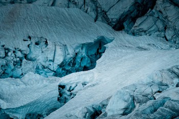 Cracks And Gaps On Rocks Covered With Ice