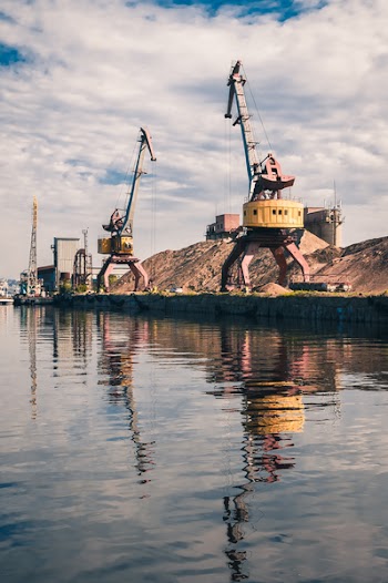 Cranes Near Body of Water