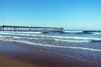 Crashing Sea Waves Near Wooden Dock