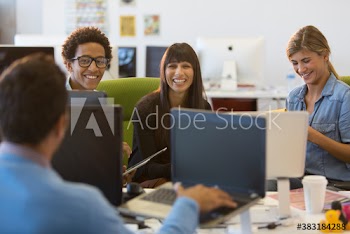 Creative business people with laptops meeting in office