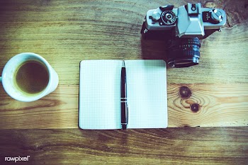 Creative desk with camera and notebook | Free public domain photo - 432067