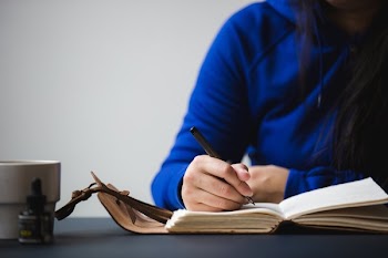 Creative Mind Writes In Journal