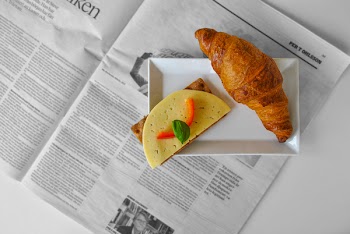 Croissant Bread and Sliced Cheese Placed on White Ceramic Saucer