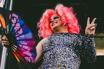 Cross Dresser Holding Hand Fan