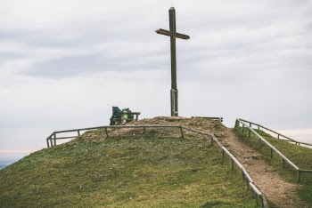 Cross on Hill With Fence