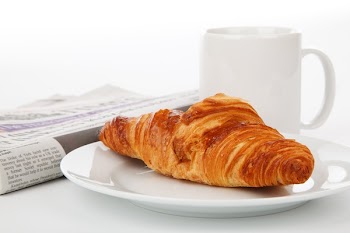 Crossant Bread on White Ceramic Plate