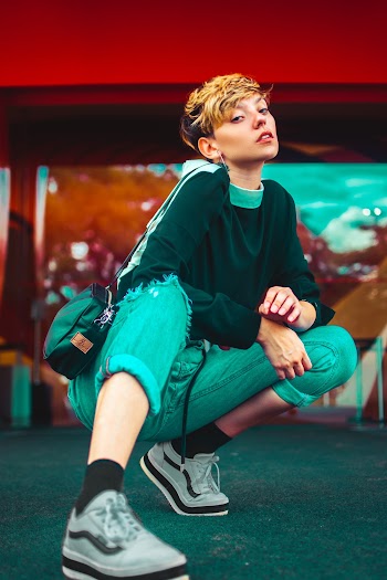 Crouching Woman Wearing Blue Pants 