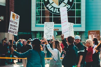 Crowd of People Holding Signages