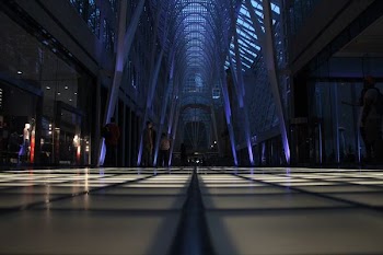 crowd of people inside triangular building interior