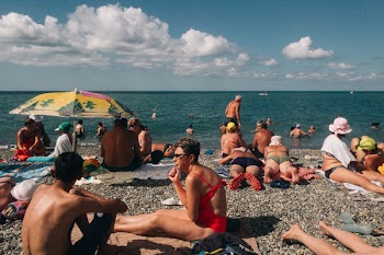 Crowd of People on Seashore Under Blue Sky