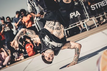 Crowd Watching A Man Doing Breakdancing