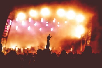 Crowds Enjoy the Headline Act at a Music Festival
