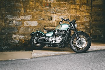 Cruiser Motorcycle Parked Near Wall