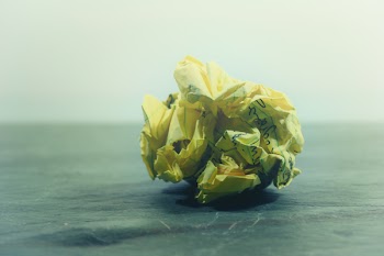 Crumpled Paper on Gray Surface