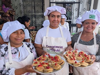 Culinary Class Participants Displaying Pastries