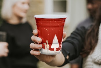 Cup mockup psd being hold | Free PSD Mockup - rawpixel