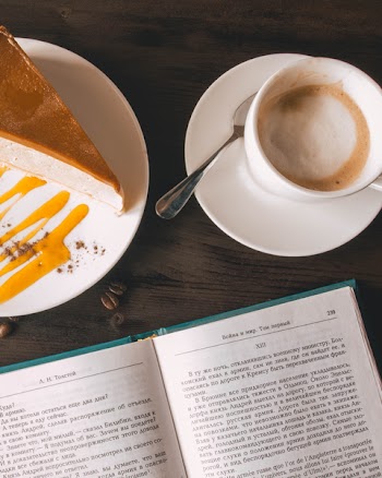 Cup of Coffee Beside Book