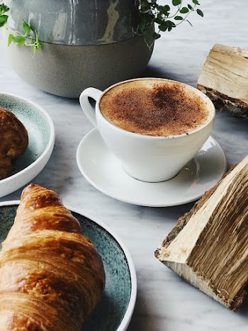 Cup of Coffee Near Croissant Bread