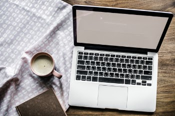 Cup of Coffee with a Macbook Pro