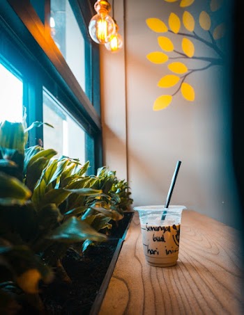 Cup of Drink Placed by the Window