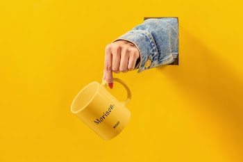 Cup with Hand Mockup morison. mockup 