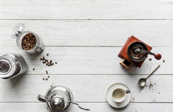 Cups With Saucer Near Coffee Grinder