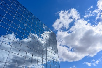 Curtain Wall Building Under Clear Blue Sky