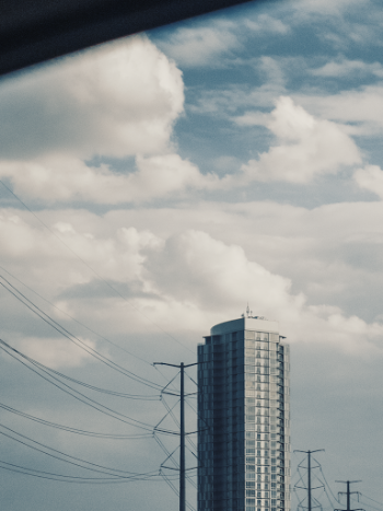 Curtain Wall High-rise Building Beside Transmission Tower
