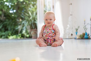 Cute baby girl on floor