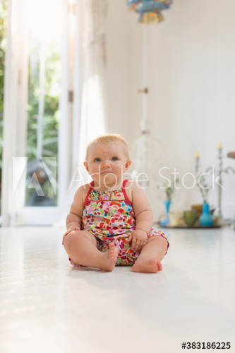 Cute baby girl on floor