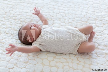 Cute baby girl on rug