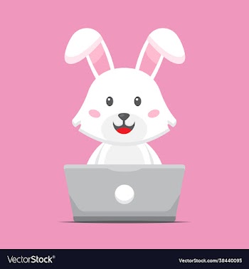 cute carrot working with laptop