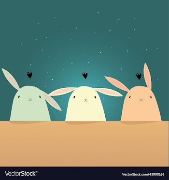 cute colorful rabbits sitting at the table