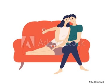 Cute couple sitting on sofa and drinking wine during romantic date