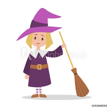 Cute girl standing in halloween witch costume