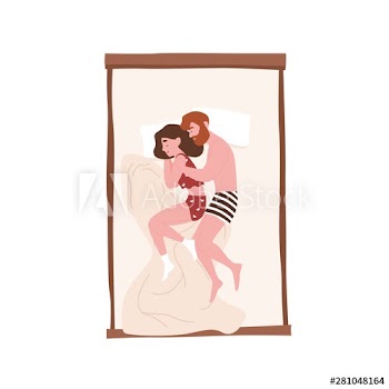 Cute sweet young couple lying in bed and cuddling or hugging
