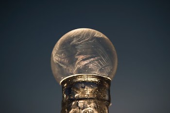 cylindrical gray pipe with round glass ball