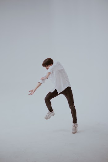 Dancing Man in White Room