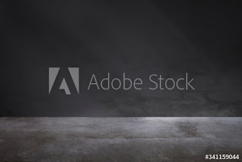 Dark gray wall with a concrete floor