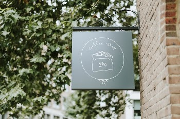 Dark green coffee shop sign | Free PSD Mockup - rawpixel