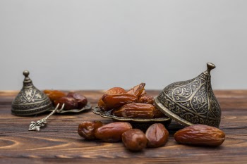 Dates fruit on plate on table