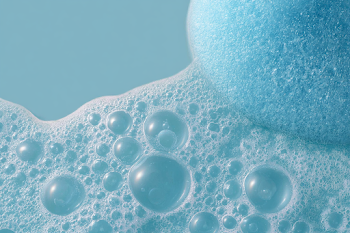 Delicate Soap Foam Bubbles on Aqua Blue Surface