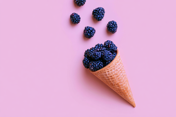 Delicious Blackberry Waffle Cone on Pink Background