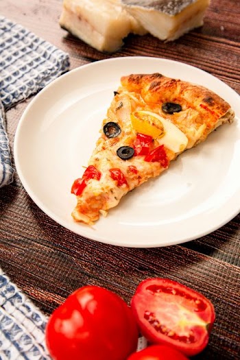 Delicious Slice of Pizza with Fresh Ingredients