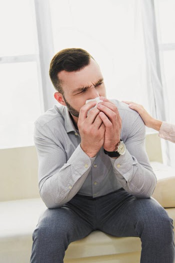 Depressed man crying in psychologist office